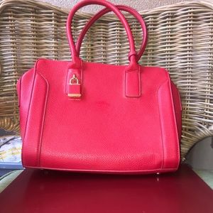 Red faux leather handbags
